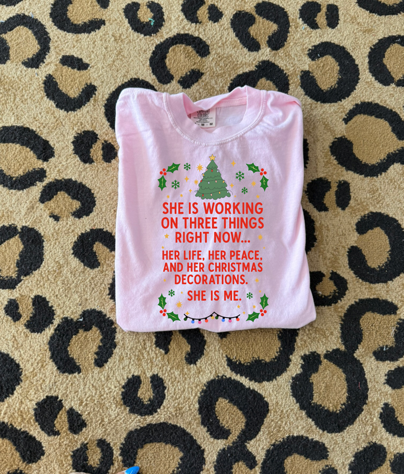 She is working on her Christmas Decorations Tee or Sweatshirt