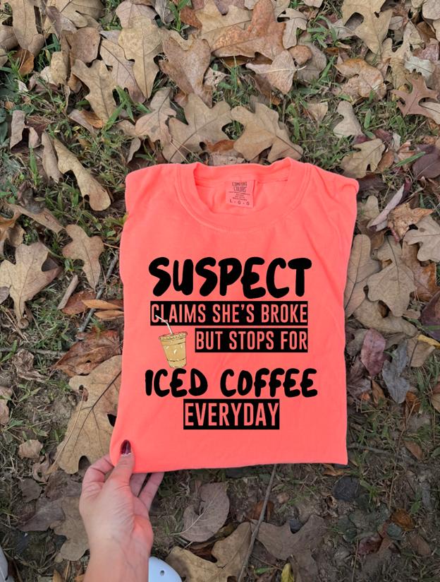 Suspect Claims she's broke but stops for iced coffee tee or sweatshirt